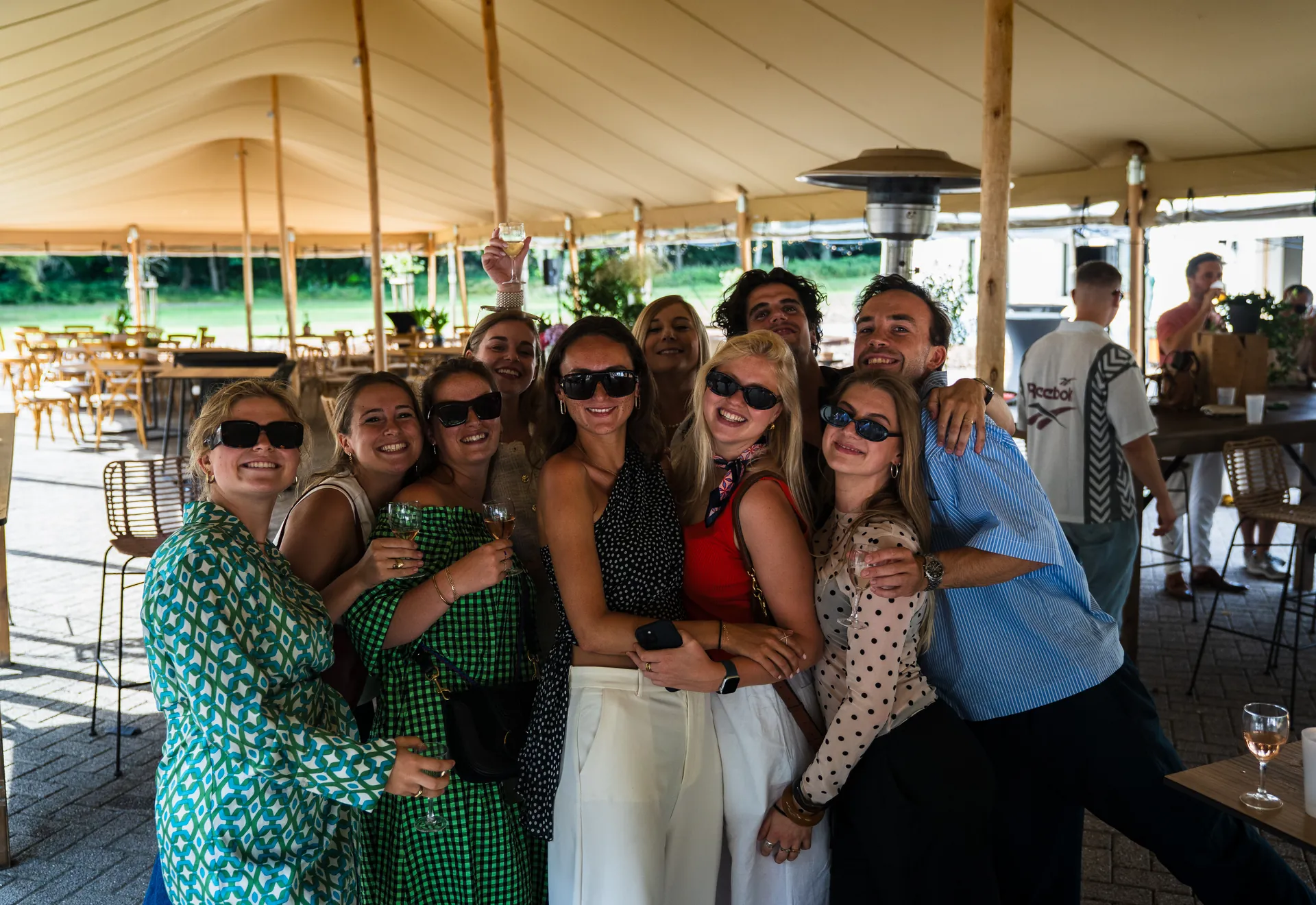 Colleagues gathered under the marquee during the PAGE staff party