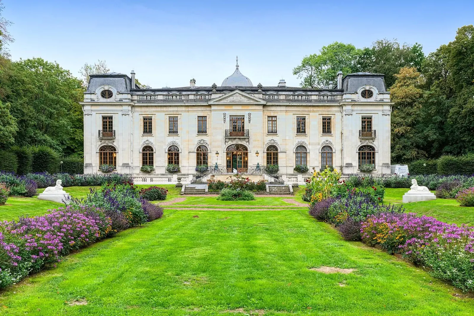 The façade of the Château d'Enghien seen from the flower gardens