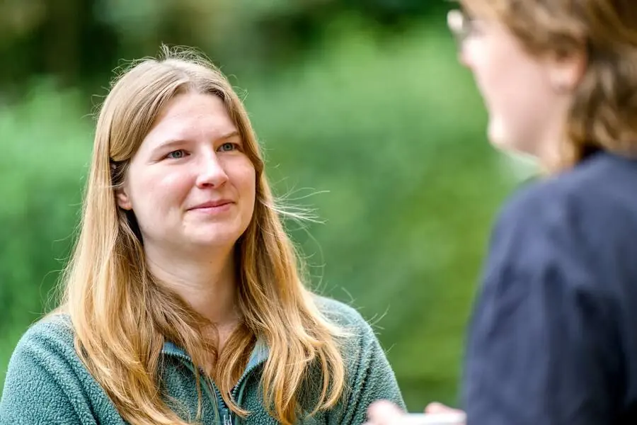A participant smiles during the welcome