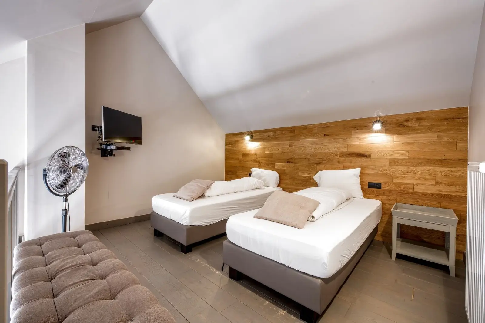 Bedroom with two beds and wooden beams