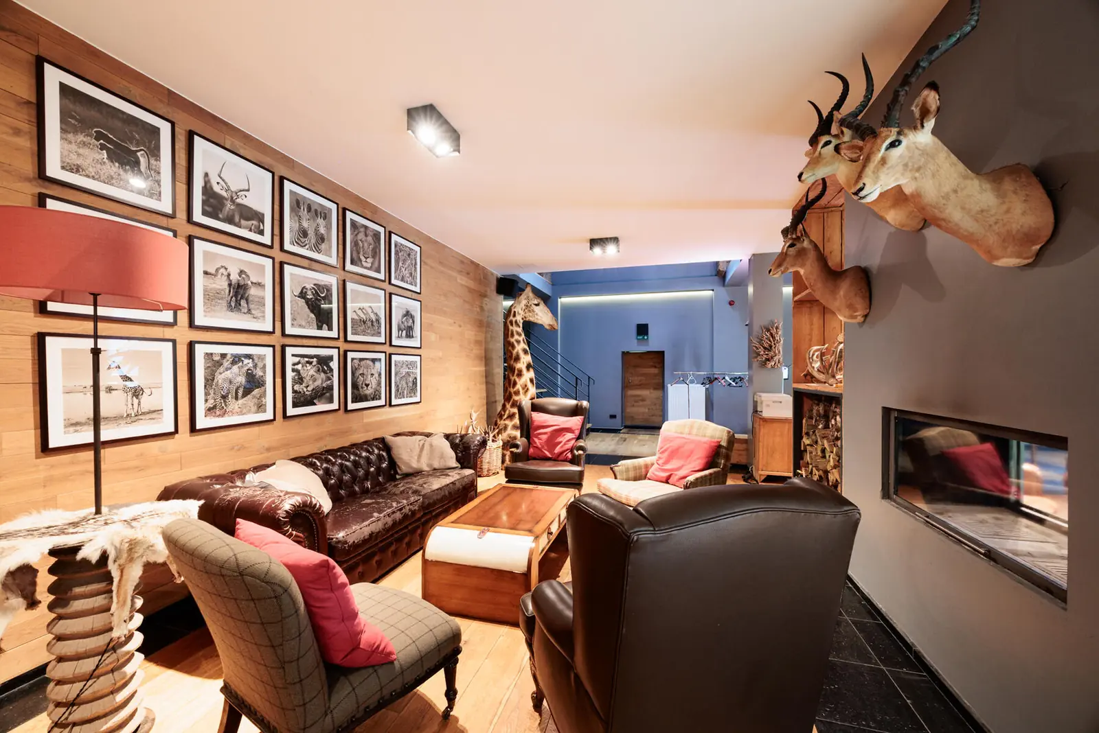 The Green Cottage lounge, with leather sofas and fireplace